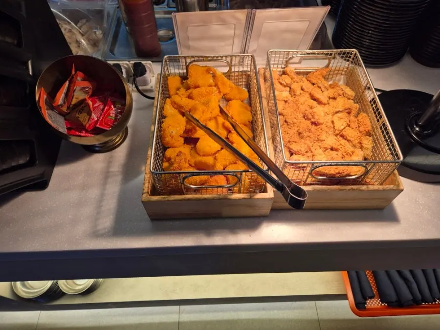 Overview of the self-serve bar set up with meat and side dishes