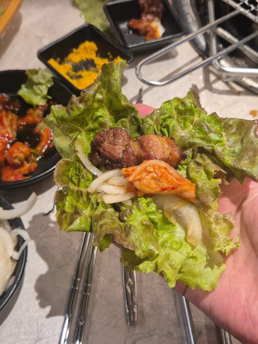 Seasoned pork rib with a wide piece of meat attached to the bone