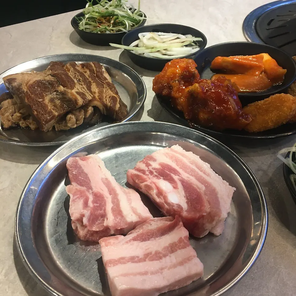 Plate of tteokbokki and seasoned fried chicken from the self-bar