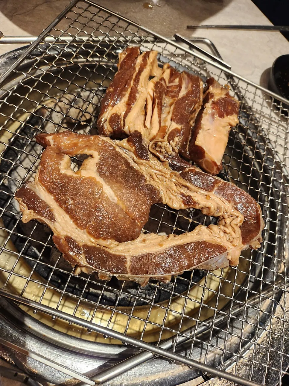 Second plate of pork belly brought to the table