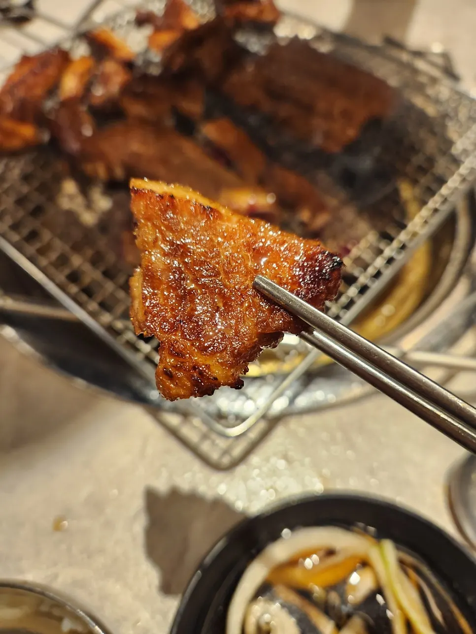Close-up of smoky, charred pork ribs