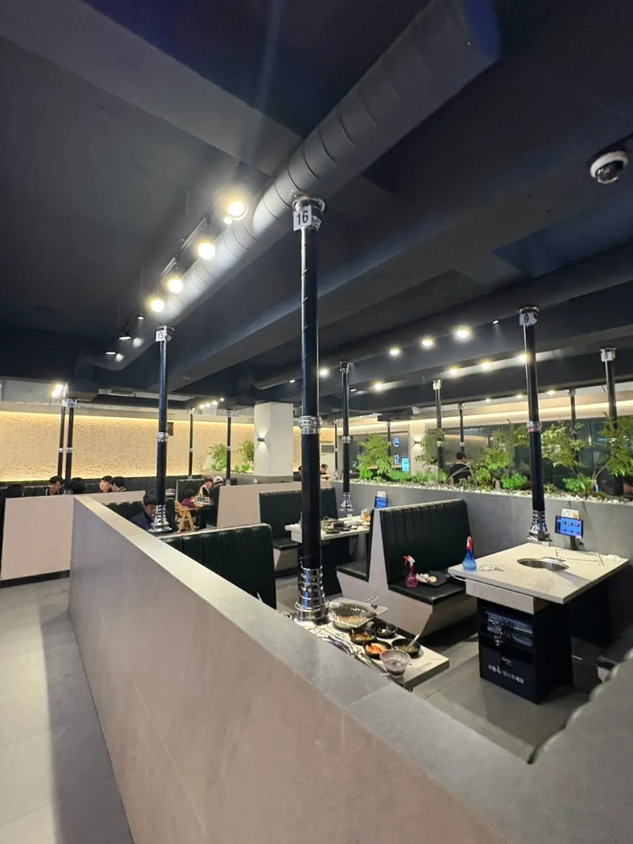 Interior of Gankeun Galbi Seongseo Branch with spacious table gaps