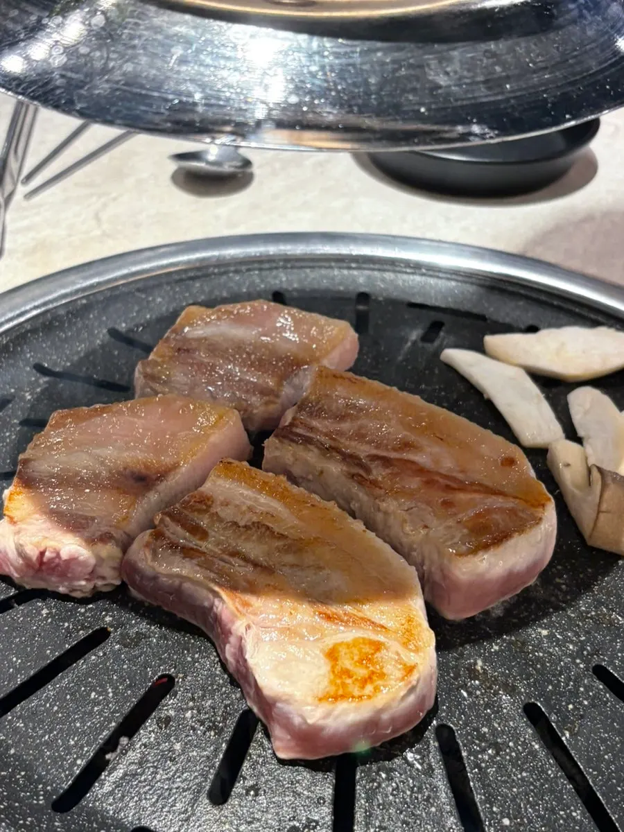 Plate of raw domestic pork belly brought from the self-bar
