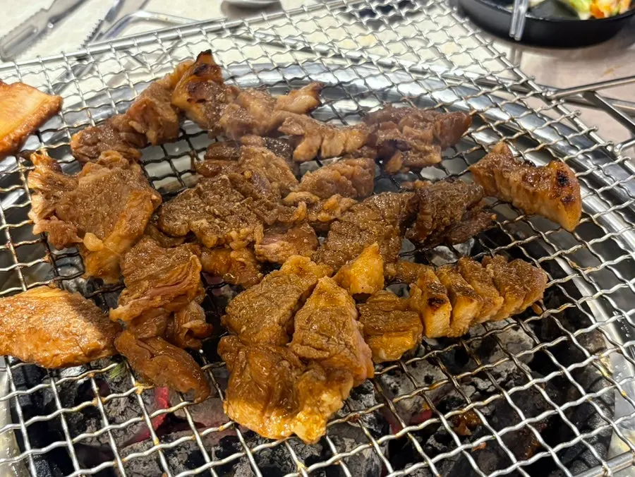 Pork rib grilling over charcoal