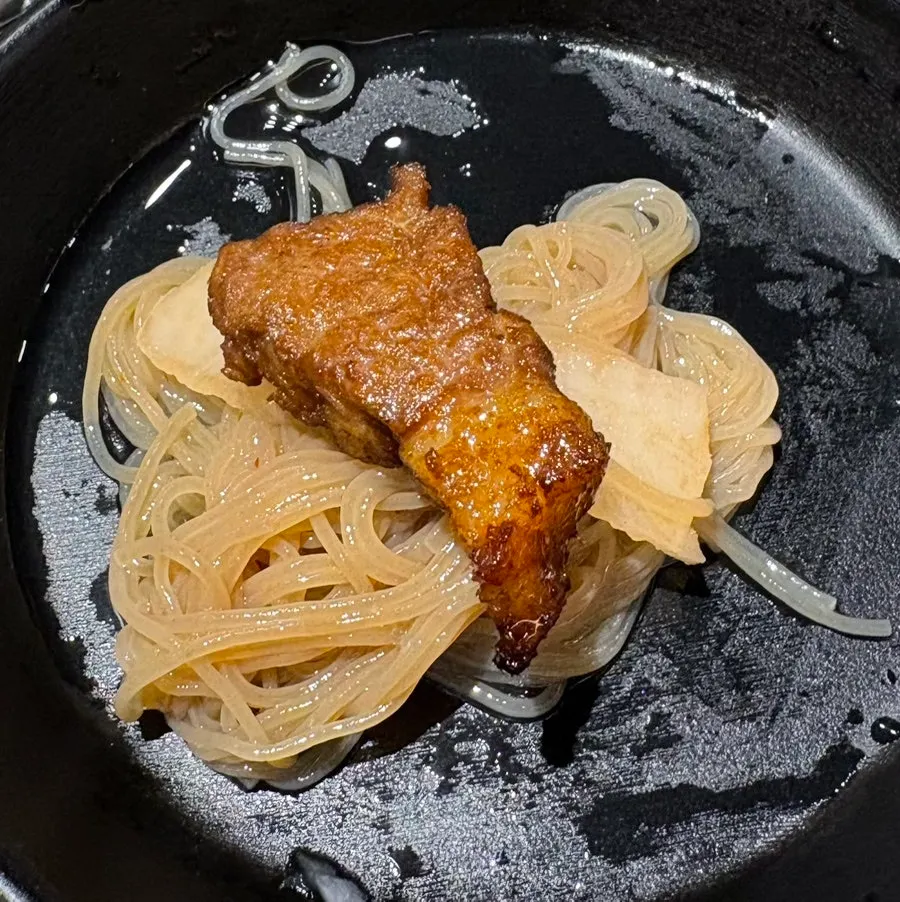 Naengmyeon served with seasoning sauce on the side
