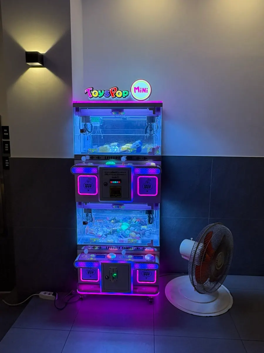 Waiting seats with a gacha machine nearby