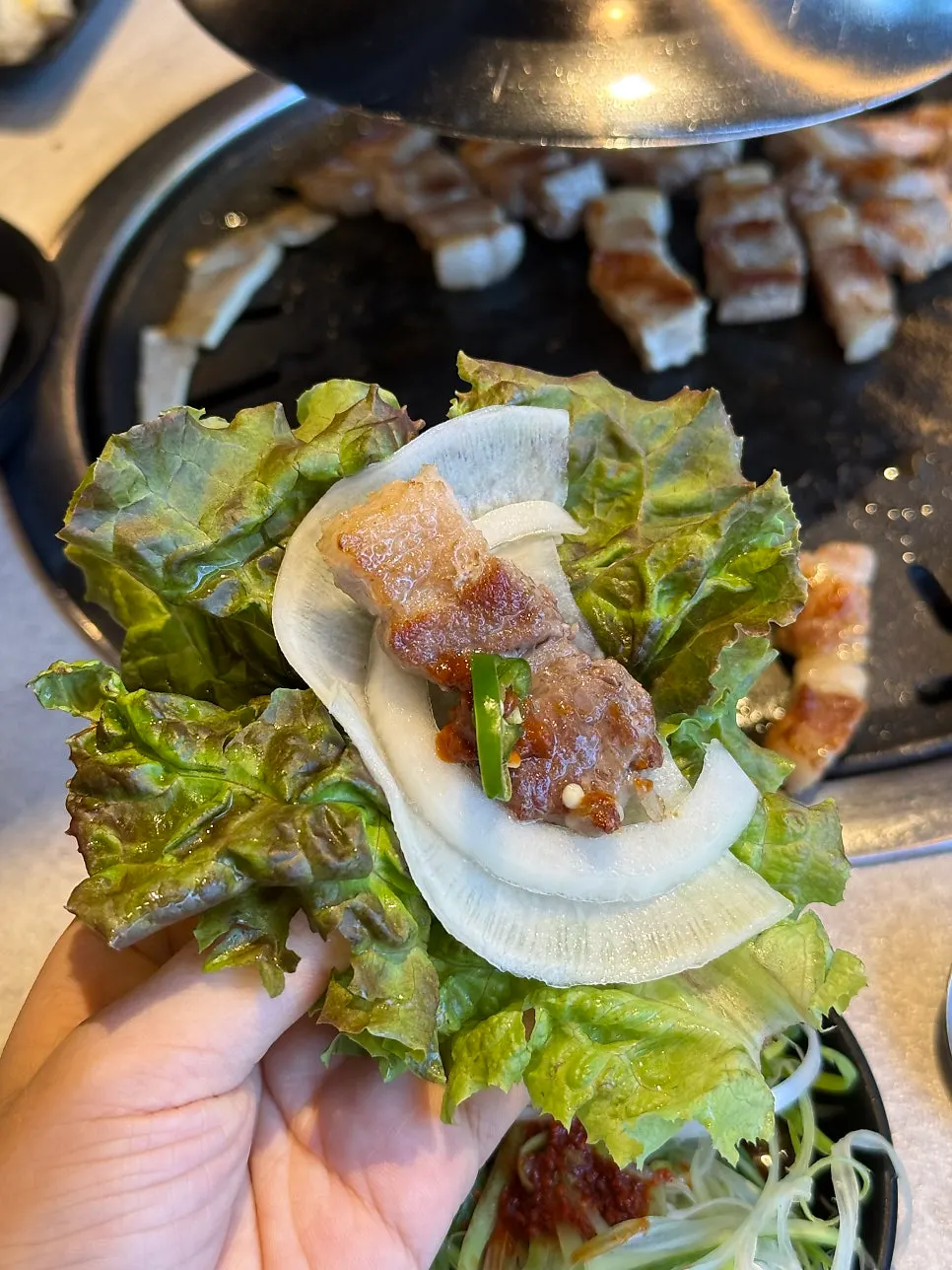 Pork belly wrapped in lettuce