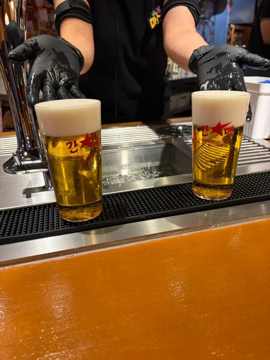 Sapporo draft beer glass with foam skimmed off