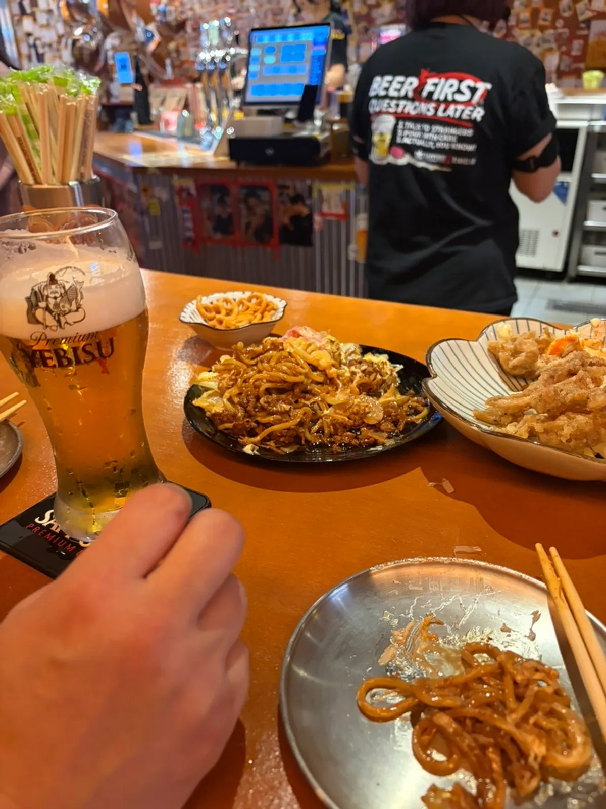 Standing table set with snacks and beer