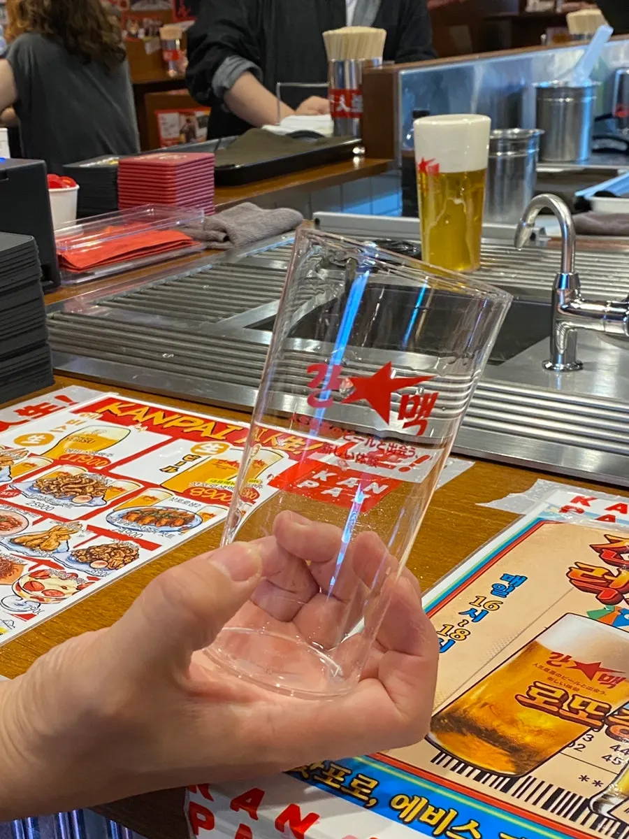 Sapporo draft beer poured into a thin glass