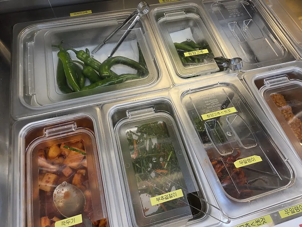 Self-serve bar with kkakdugi and kimchi neatly arranged