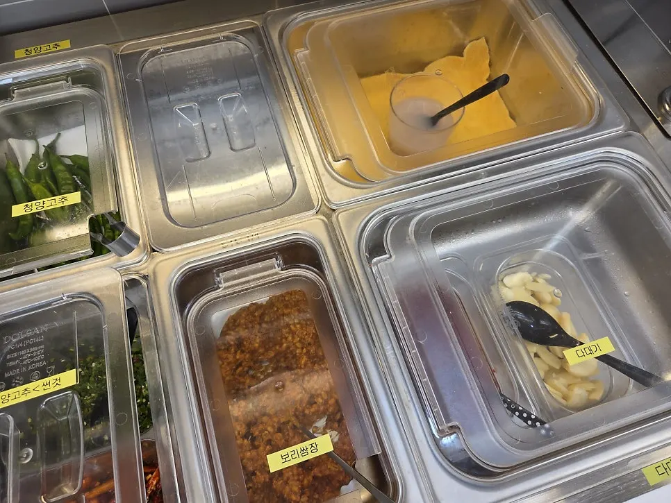 Self-serve bar side dishes including peppers and onions