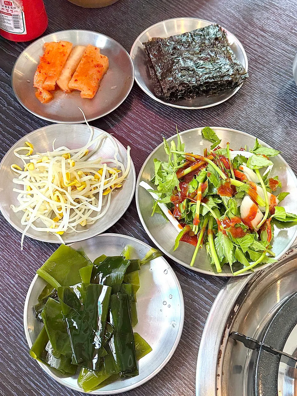 A full spread of Gapmaejeong's basic side dishes