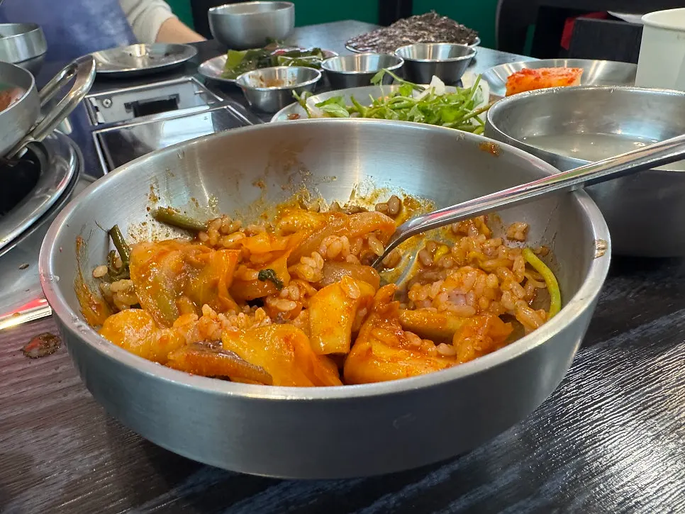 A chopstick-full of thick cuttlefish flesh