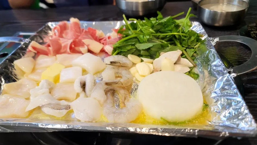 A plate of seafood and brisket grilled in butter