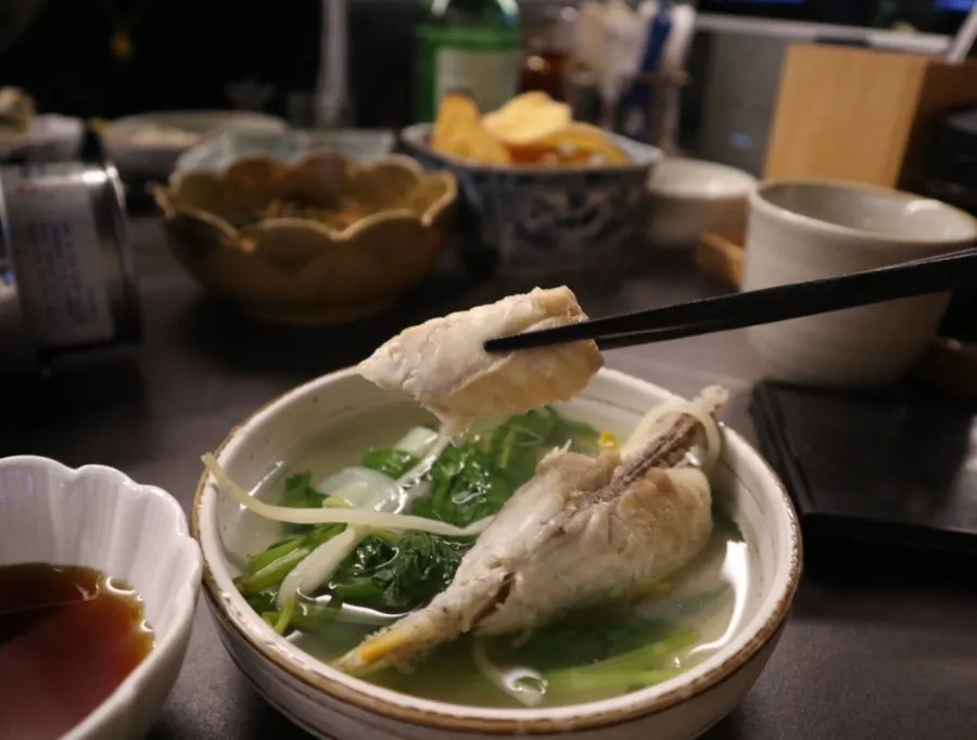 Fugu nabe with vegetables bubbling in the pot