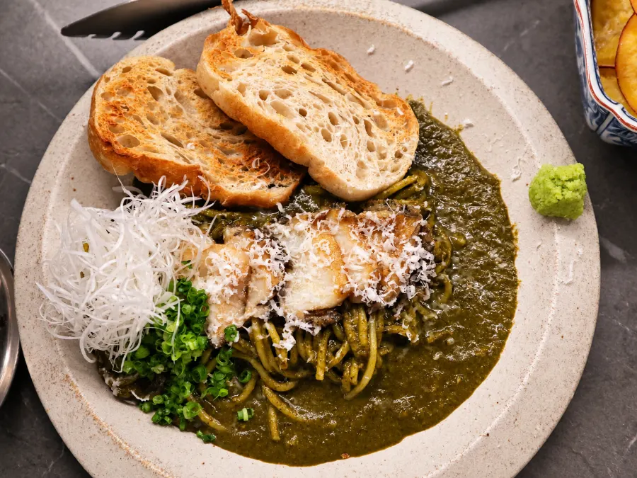 A plate of abalone intestine pasta set on the table