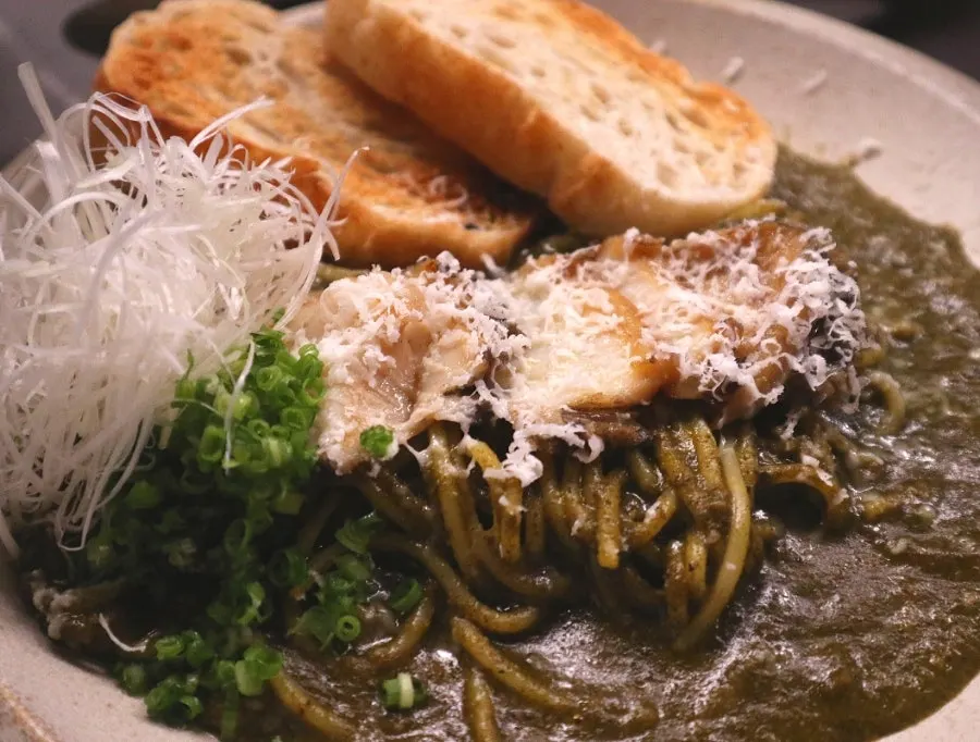 Abalone intestine pasta topped with abalone and cheese