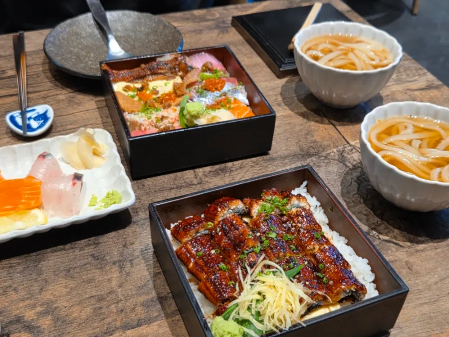 The full spread of the two-person sharing main dishes