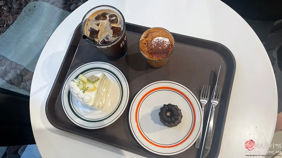 Table with ordered coffee and desserts