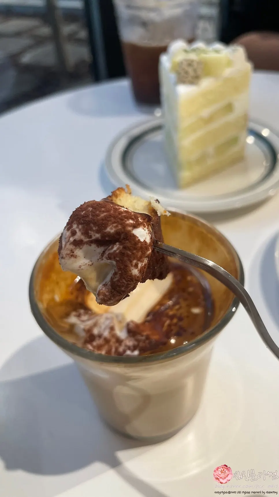 Dipping a financier into the pine nut cream signature coffee