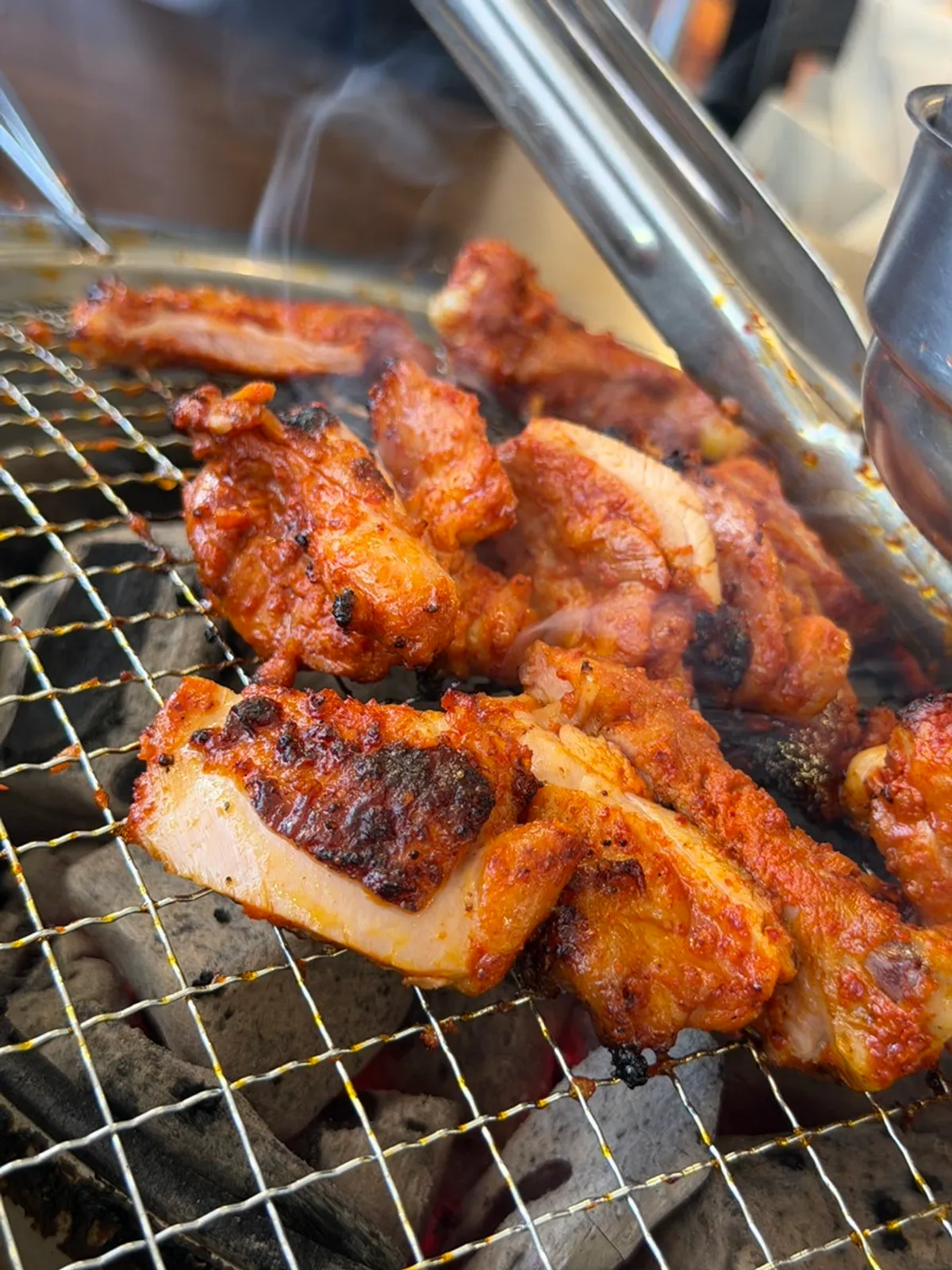 A full spread of Gapyeong Anbanji seasoned dakgalbi