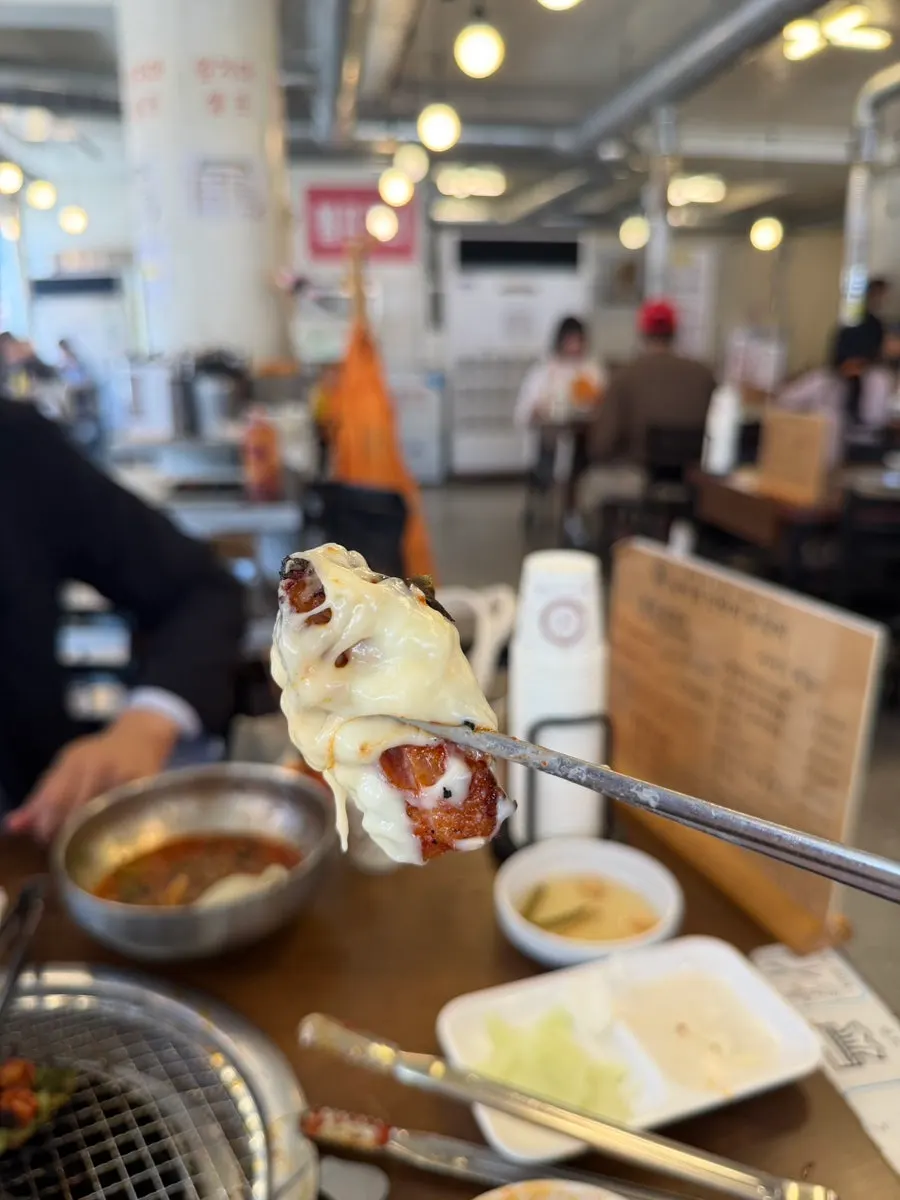 Dakgalbi dipped in cheese fondue
