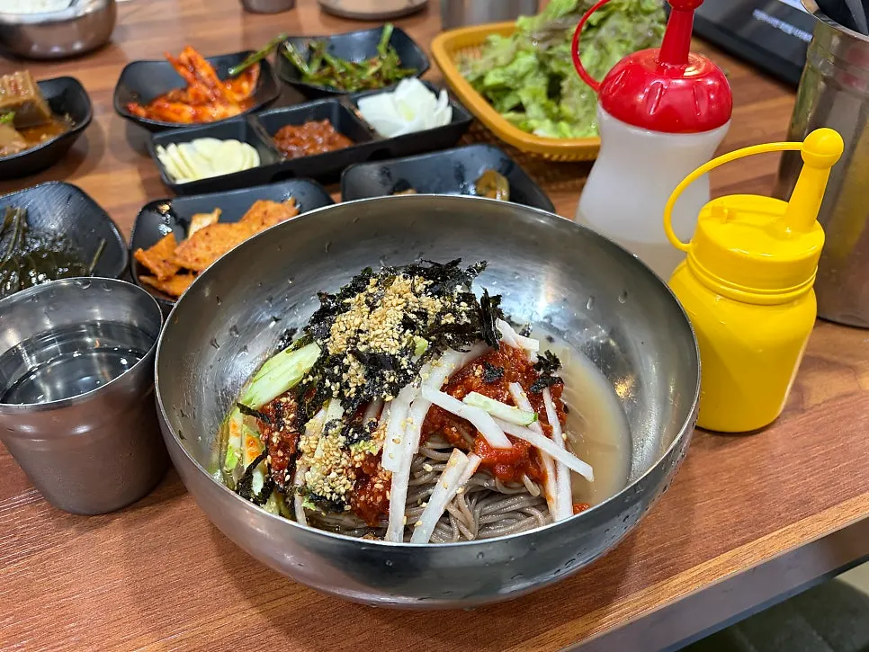 Dakgalbi wrap with perilla leaves and seasoned deodeok root