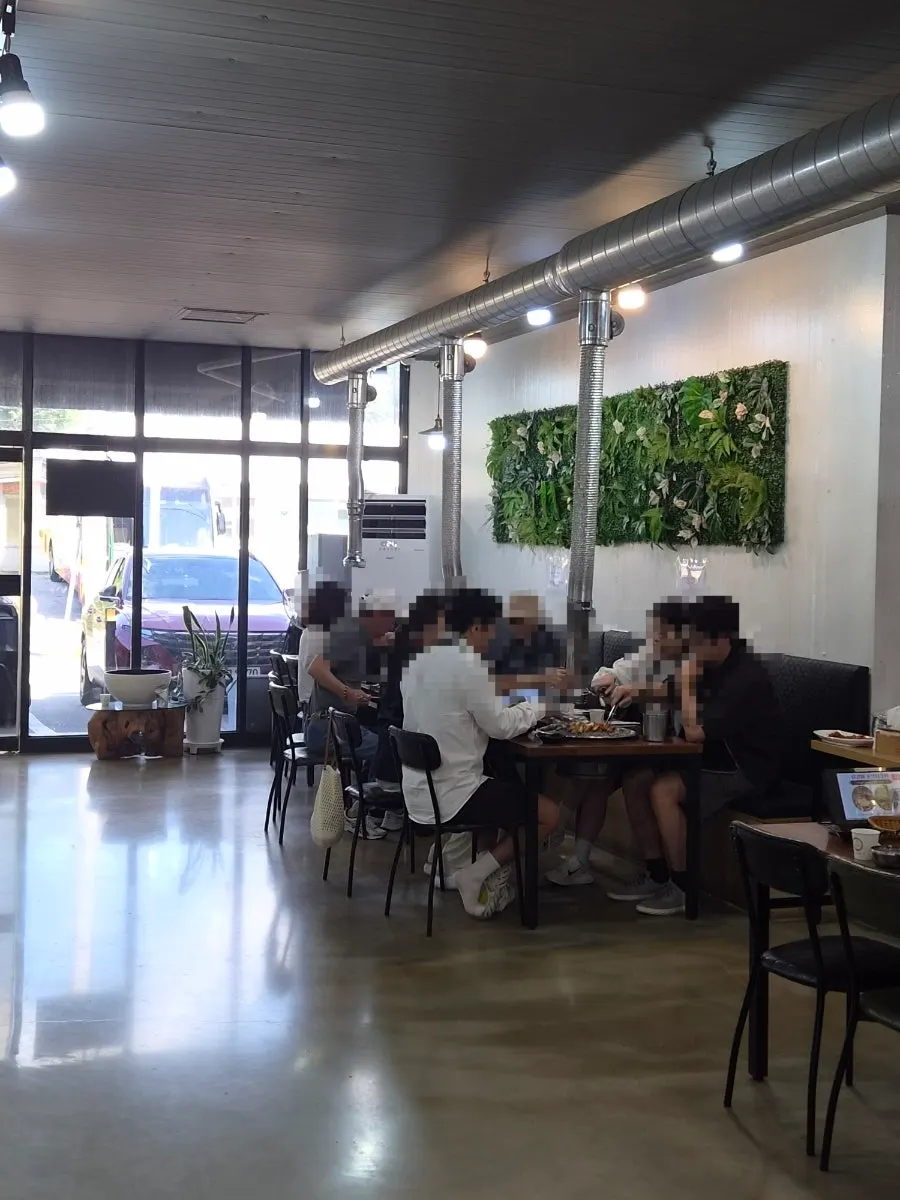 Spacious dining hall with plenty of tables at the dakgalbi restaurant
