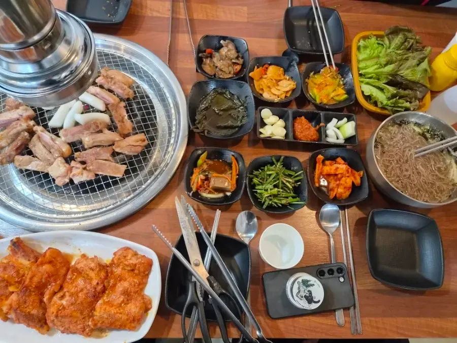 Table set with half spicy, half soy dakgalbi order