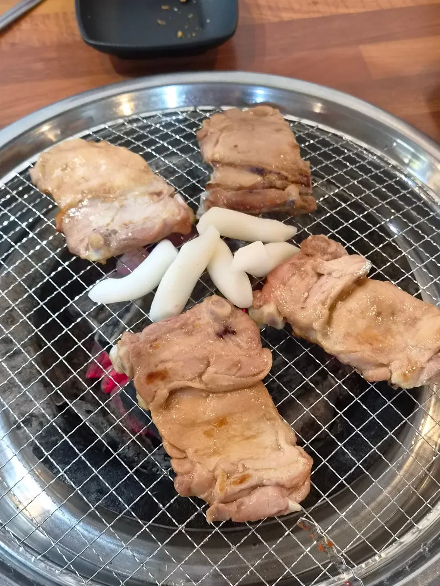 Domestic chicken thigh meat grilled over charcoal