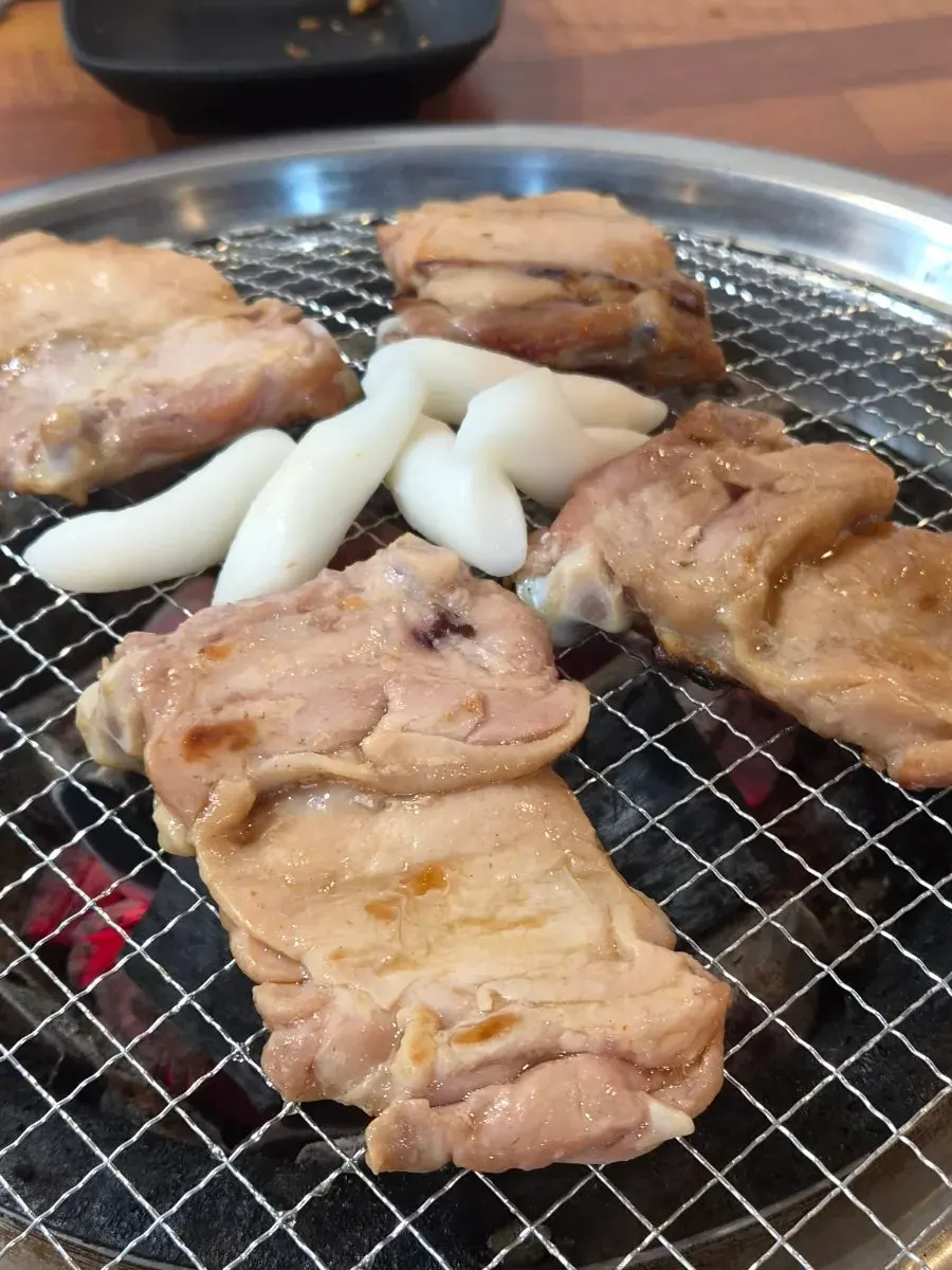 Table spread of dakgalbi eaten by the family of four