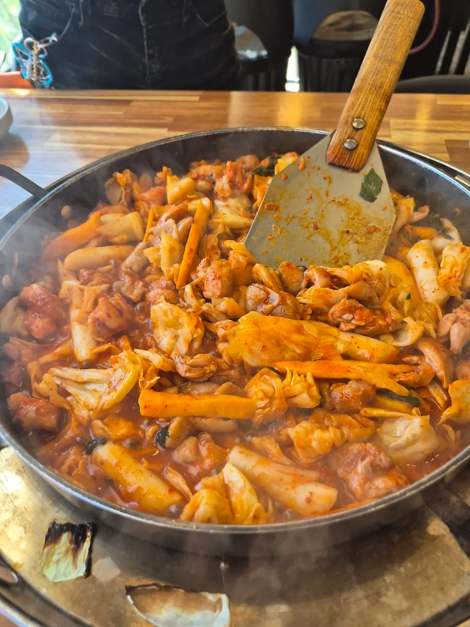 Seasoned dakgalbi and vegetables on the hot plate