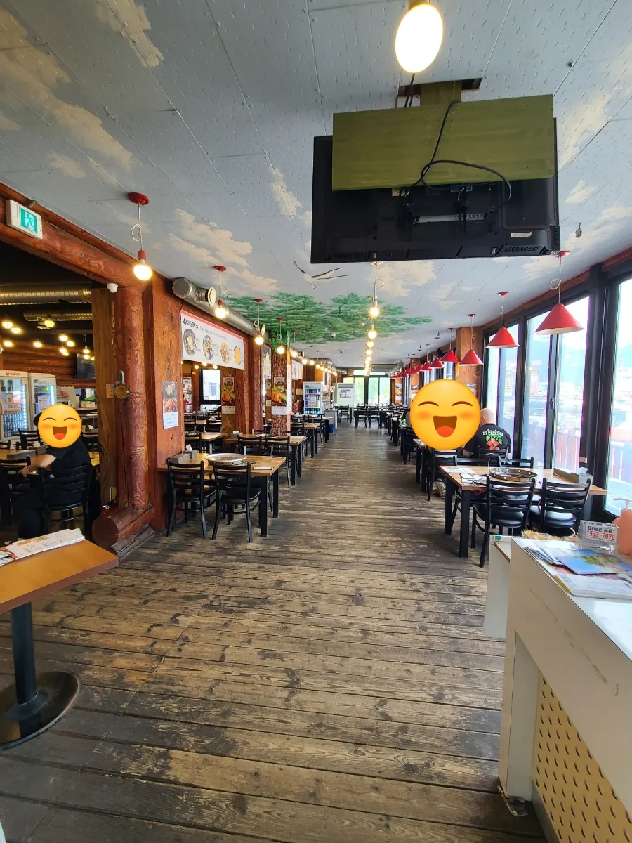 Spacious dining room with window seats overlooking the river