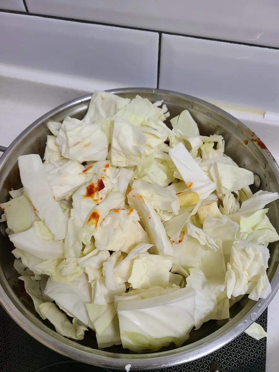 Dakgalbi being stir-fried as the sauce soaks in