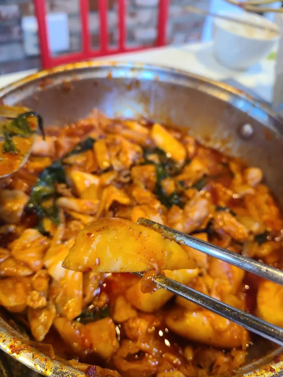 Full spread of pension dakgalbi with rice and beer