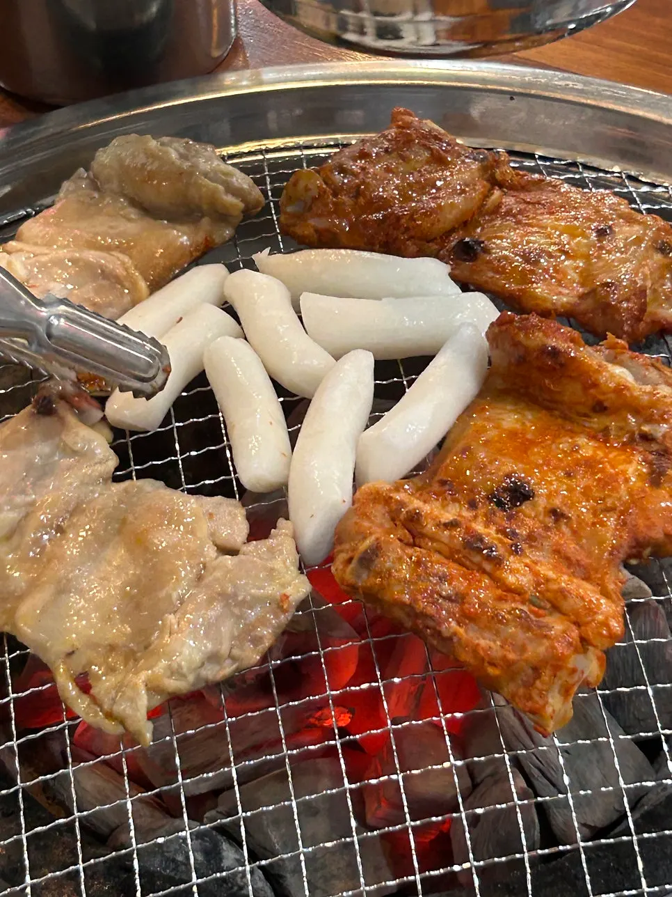 Seasoned dakgalbi and soy-sweet dakgalbi served at the table