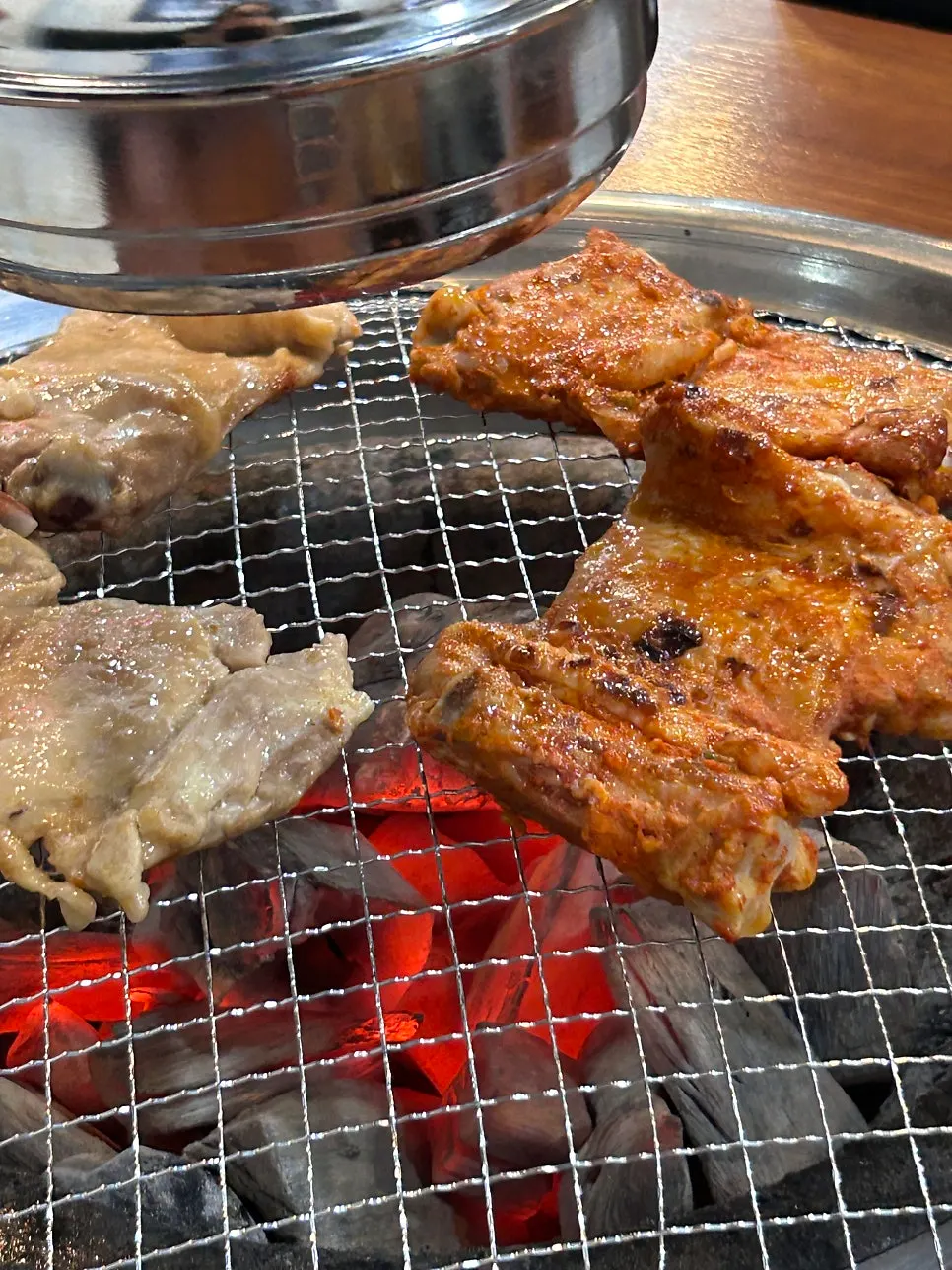 Dakgalbi placed on the charcoal grill