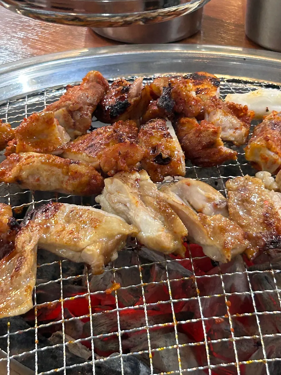 A golden-brown piece of grilled dakgalbi