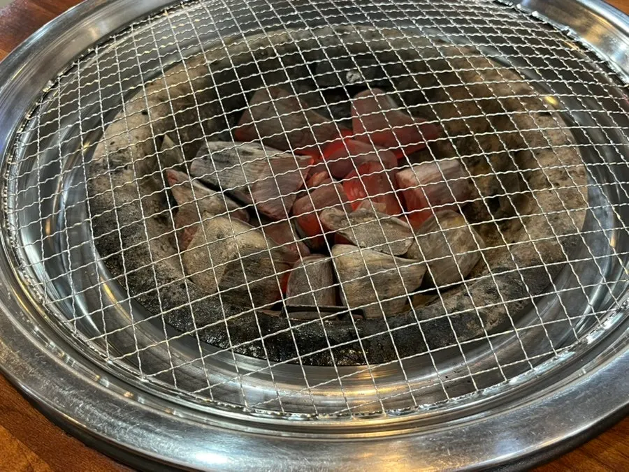 Charcoal grill brought to the table