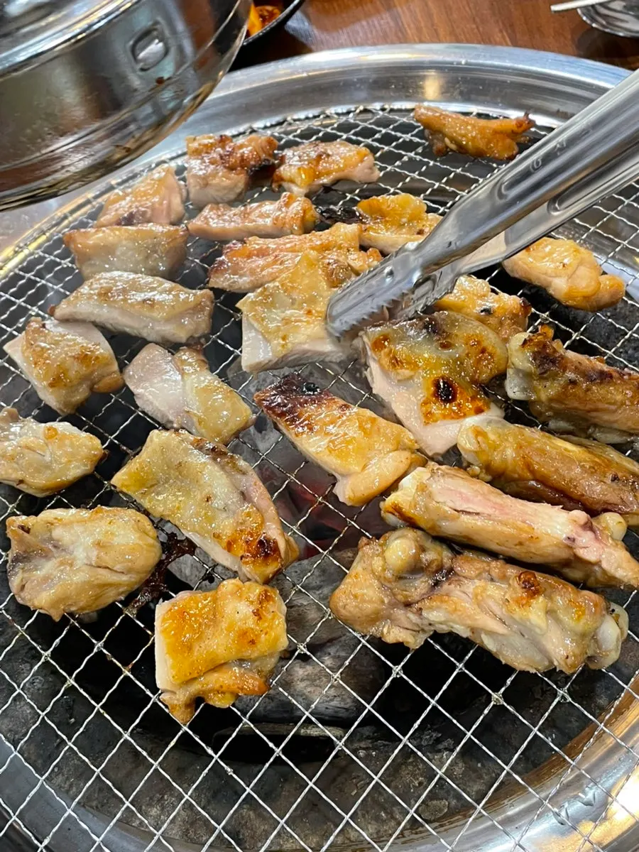 Soy-sauce dakgalbi grilling over charcoal