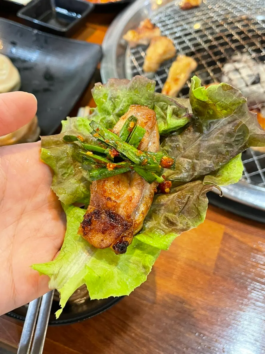 Soy-sauce dakgalbi topped with deodeok muchim