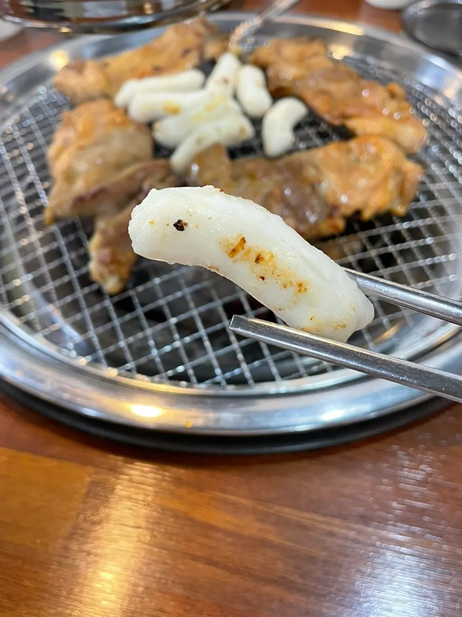 Rice cakes grilled alongside on the charcoal