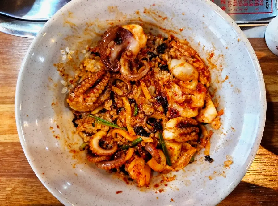 Grilled octopus rice bowl properly mixed with octopus and vegetables