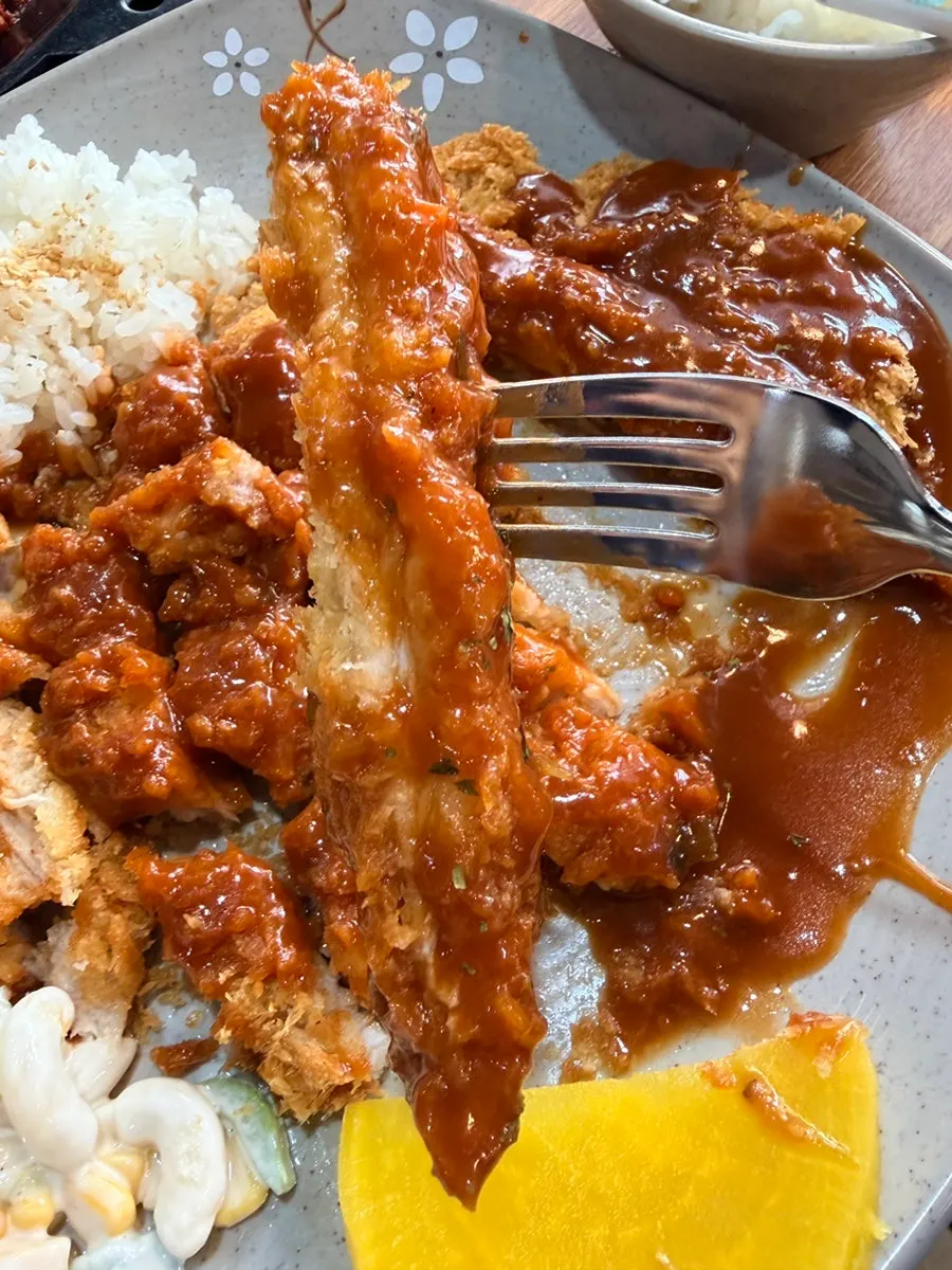 Cross-section of the pork loin cutlet with sauce