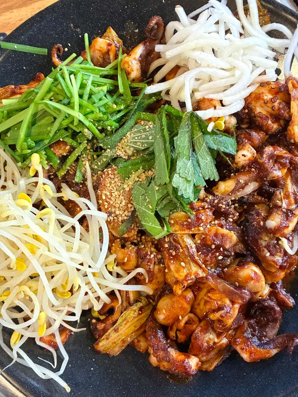 Jjukkumi griddle stir-fry cooked in the kitchen and served fresh