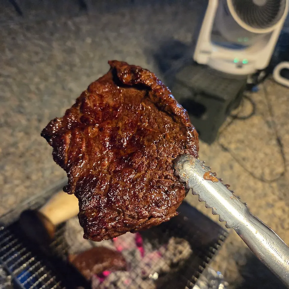 Beef browned over charcoal