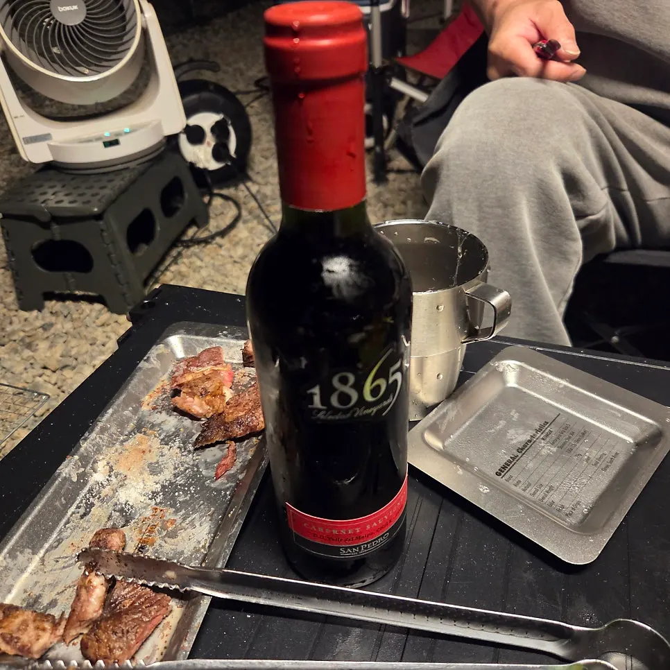 A glass of wine paired with beef