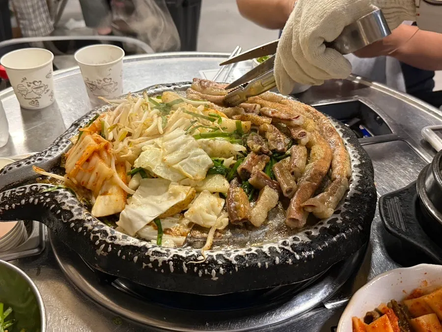 Well-cooked gopchang on the grill