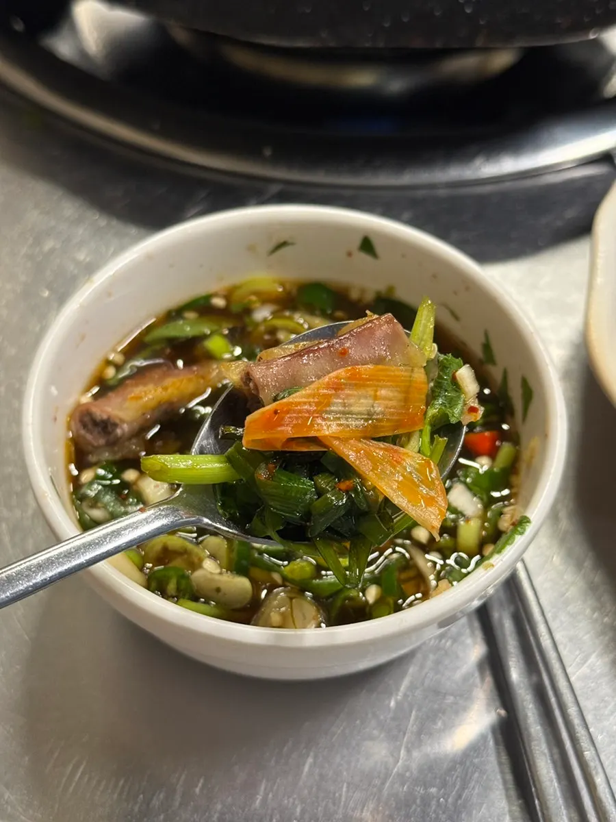 Gopchang plated with side vegetables